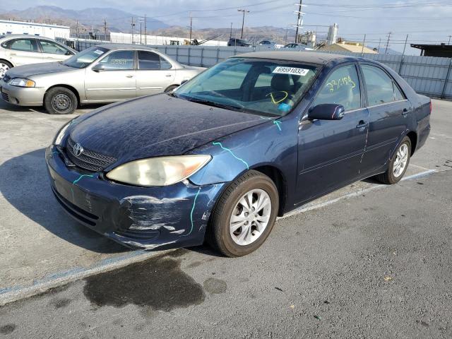 TOYOTA CAMRY LE 2004 with VIN 4T1BF32K74U066854 - Photo from auction