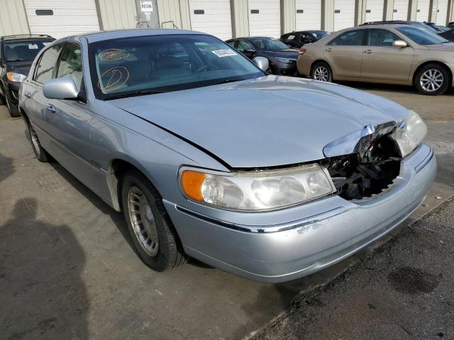 Photo 4 from auction – 1999 LINCOLN TOWN CAR E with VIN 1LNHM81W2XY632918