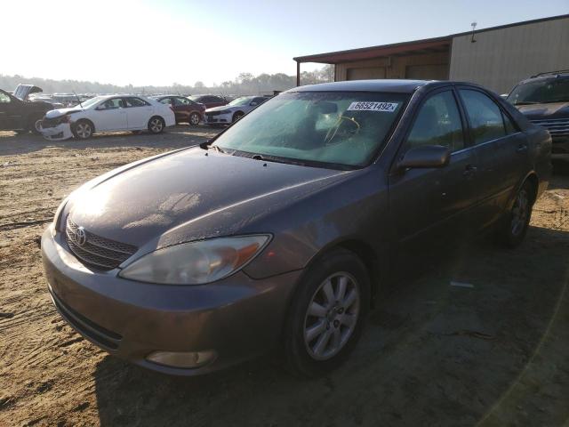 TOYOTA CAMRY LE 2004 with VIN 4T1BF30K74U572056 - Photo from auction
