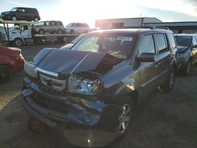 HONDA PILOT TOUR 2010 with VIN 5FNYF3H88AB011859 - Photo from auction