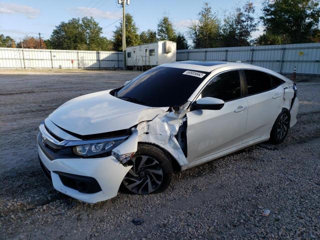 HONDA CIVIC EX 2018 with VIN 19XFC2F80JE009977 - Photo from auction