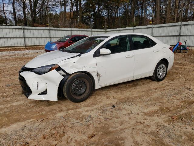 TOYOTA COROLLA L 2019 with VIN 5YFBURHE9KP864829 - Photo from auction