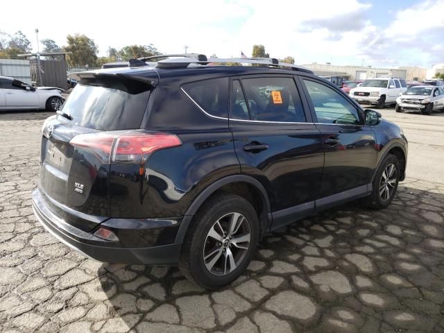 Photo 3 from auction – 2016 TOYOTA RAV4 XLE with VIN 2T3RFREV8GW409755