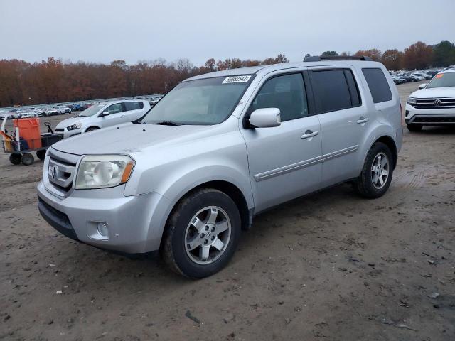 HONDA PILOT TOUR 2010 with VIN 5FNYF4H94AB006916 - Photo from auction