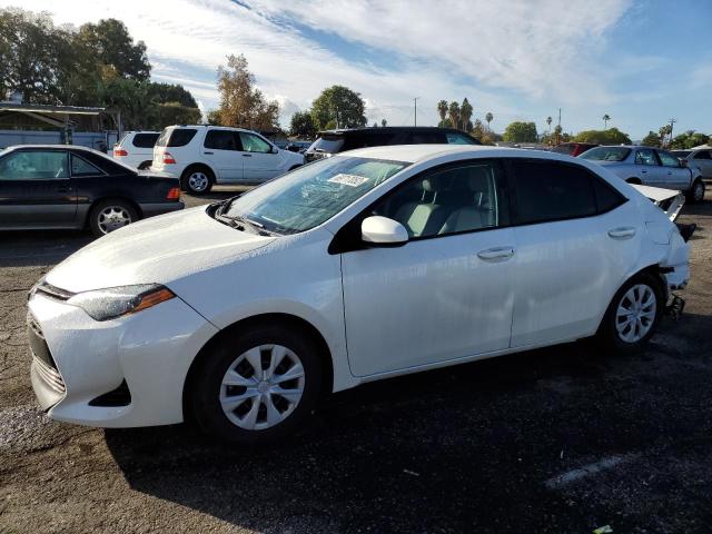 TOYOTA COROLLA LE 2017 with VIN 5YFBPRHE9HP667613 - Photo from auction