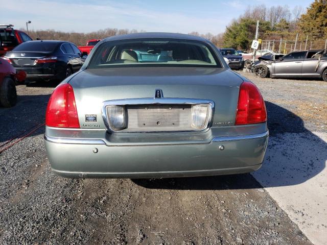 Photo 6 from auction – 2004 LINCOLN TOWN CAR E with VIN 1LNHM81W94Y604173