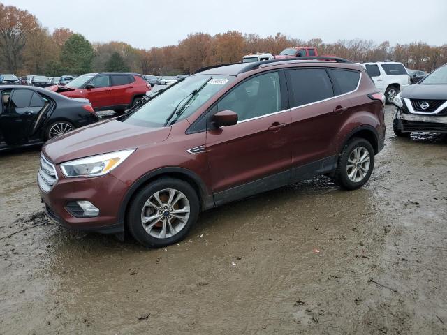 FORD ESCAPE SE 2018 with VIN 1FMCU0GD7JUB85115 - Photo from auction