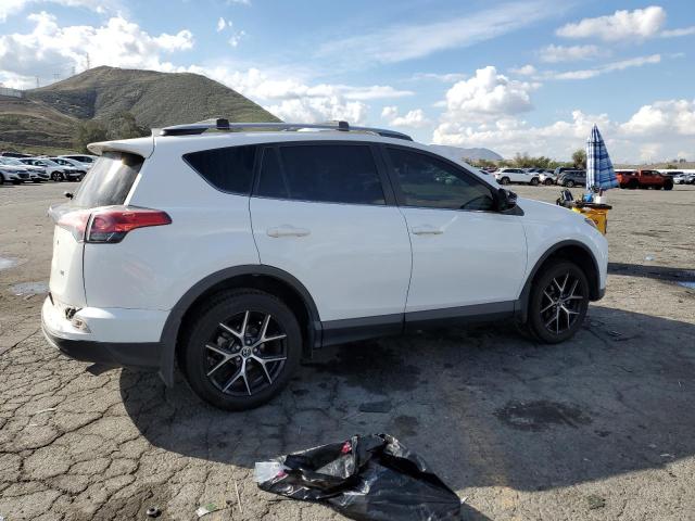 Photo 3 from auction – 2018 TOYOTA RAV4 SE with VIN JTMNFREV3JD109186