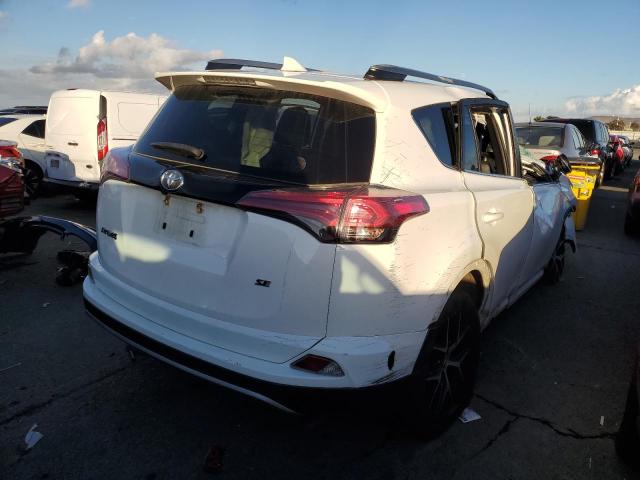 Photo 3 from auction – 2018 TOYOTA RAV4 SE with VIN JTMNFREV8JJ173211