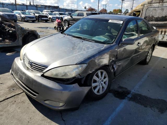TOYOTA CAMRY LE 2004 with VIN 4T1BF32K04U579251 - Photo from auction