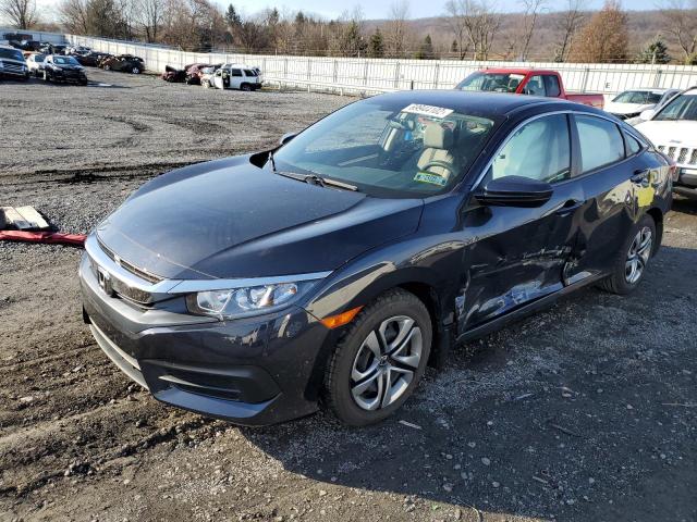 HONDA CIVIC LX 2018 with VIN 2HGFC2E57JH604970 - Photo from auction
