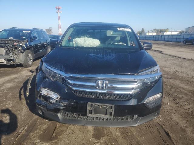 Photo 5 from auction – 2018 HONDA PILOT LX with VIN 5FNYF5H18JB004277