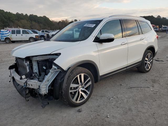 HONDA PILOT TOUR 2018 with VIN 5FNYF5H9XJB014413 - Photo from auction