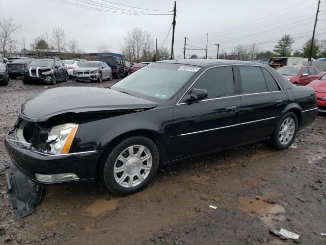 CADILLAC DTS 2010 with VIN 1G6KA5EY4AU122956 - Photo from auction