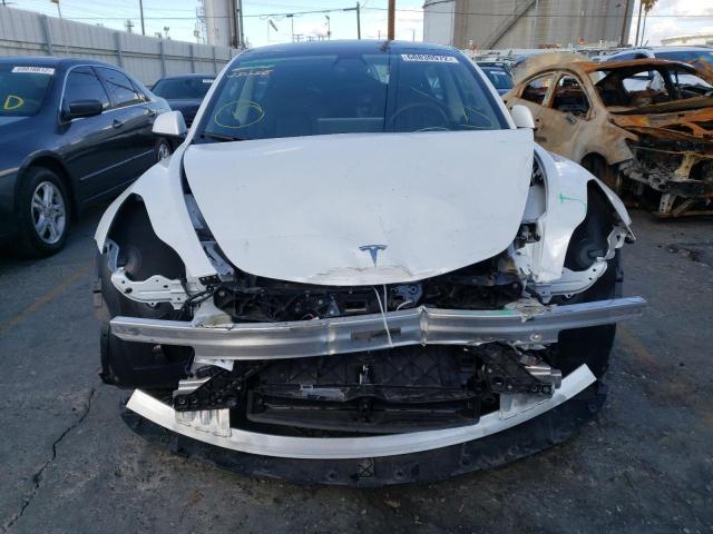 Photo 5 from auction – 2021 TESLA MODEL 3 with VIN 5YJ3E1EA4MF920064