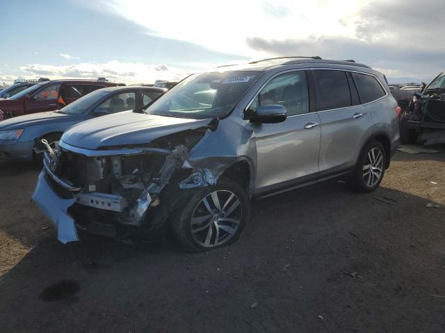 HONDA PILOT TOUR 2016 with VIN 5FNYF6H96GB085235 - Photo from auction