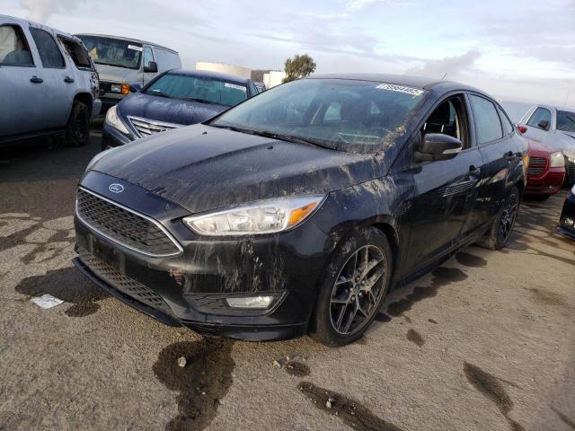 FORD FOCUS SE 2015 with VIN 1FADP3F22FL386201 - Photo from auction