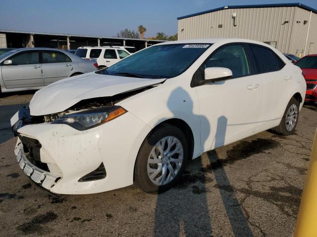 TOYOTA COROLLA L 2019 with VIN 5YFBURHE6KP933282 - Photo from auction