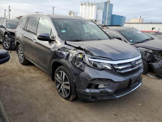 Photo 4 from auction – 2018 HONDA PILOT ELIT with VIN 5FNYF6H04JB030811