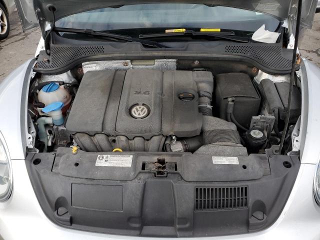 Photo 11 from auction – 2014 VOLKSWAGEN BEETLE with VIN 3VWHP7AT1EM609230