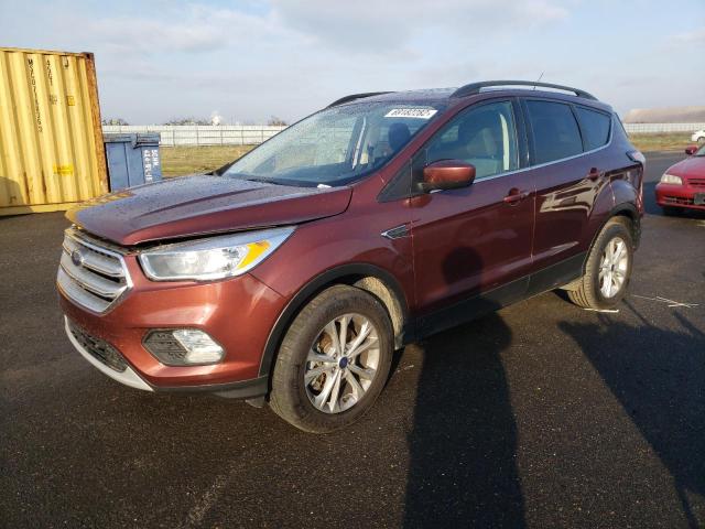FORD ESCAPE SE 2018 with VIN 1FMCU9GDXJUB75831 - Photo from auction