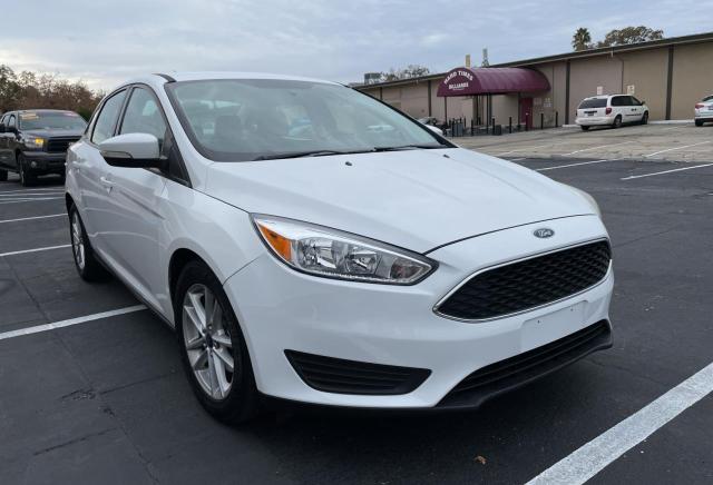 FORD FOCUS SE 2015 with VIN 1FADP3F29FL204543 - Photo from auction