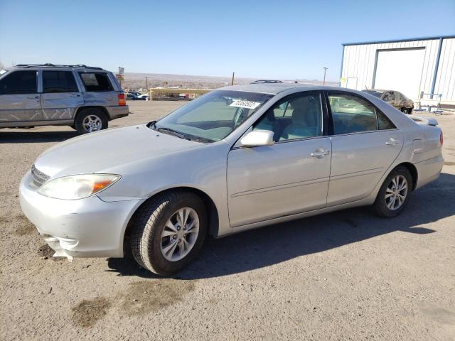 TOYOTA CAMRY LE 2004 with VIN 4T1BF30KX4U581964 - Photo from auction