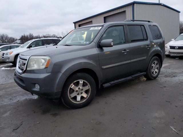 HONDA PILOT TOUR 2011 with VIN 5FNYF4H9XBB059251 - Photo from auction