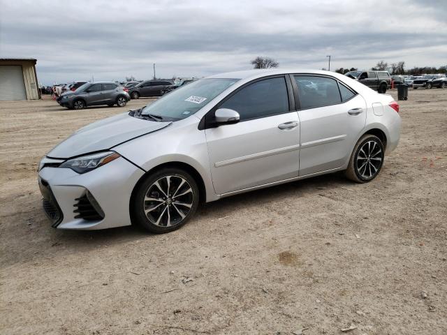 TOYOTA COROLLA L 2018 with VIN 5YFBURHE9JP764129 - Photo from auction