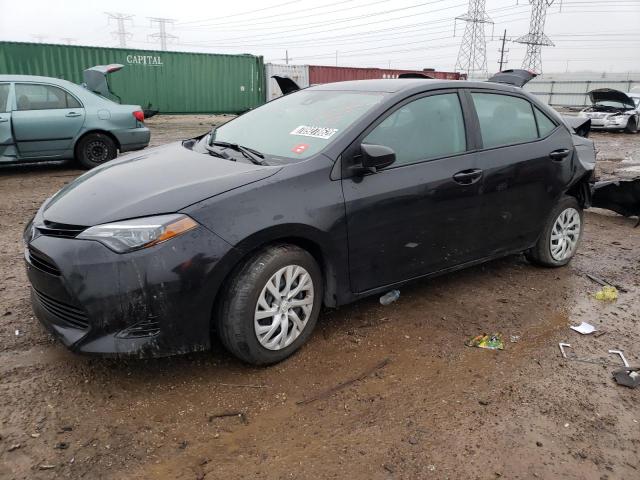 TOYOTA COROLLA L 2019 with VIN 5YFBURHE1KP876165 - Photo from auction