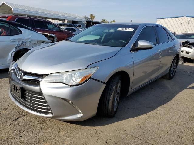 TOYOTA CAMRY LE 2015 with VIN 4T4BF1FK9FR447015 - Photo from auction