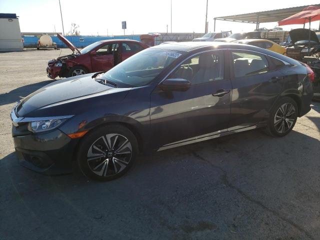 Photo 1 from auction – 2018 HONDA CIVIC EX with VIN JHMFC1F47JX012722