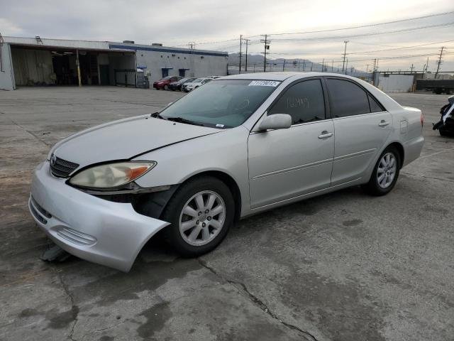 TOYOTA CAMRY LE 2002 with VIN 4T1BF30K32U034113 - Photo from auction