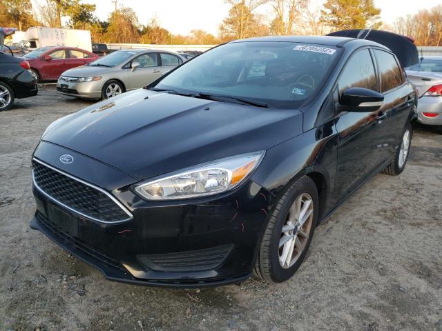 FORD FOCUS SE 2016 with VIN 1FADP3F23GL287341 - Photo from auction