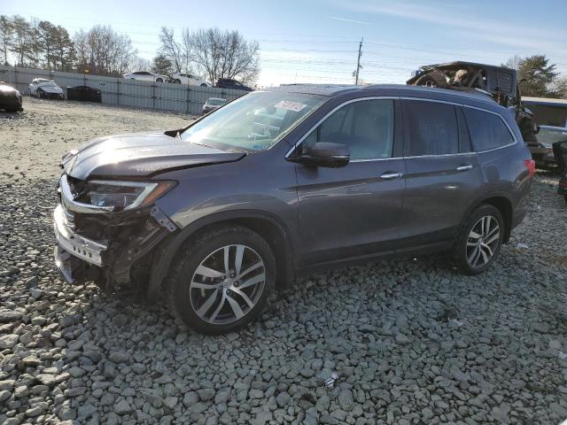 HONDA PILOT TOUR 2018 with VIN 5FNYF6H97JB026752 - Photo from auction