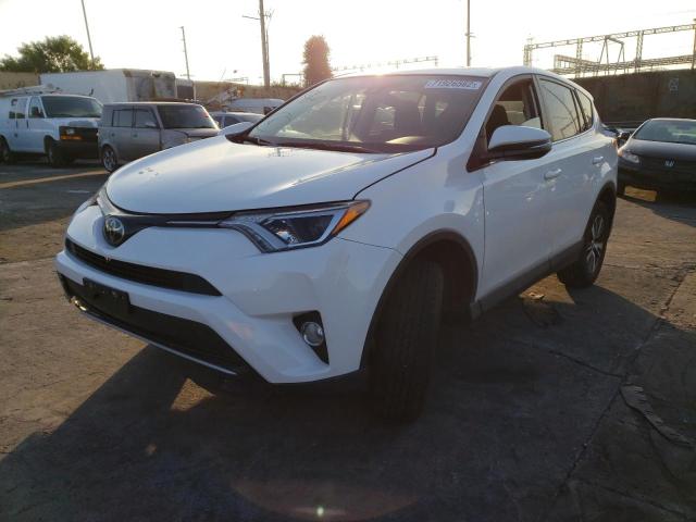 TOYOTA RAV4 XLE 2017 with VIN JTMWFREV0HJ718185 - Photo from auction
