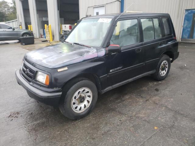 SUZUKI SIDEKICK J 1997 with VIN 2S3TE02VXV6404799 - Photo from auction