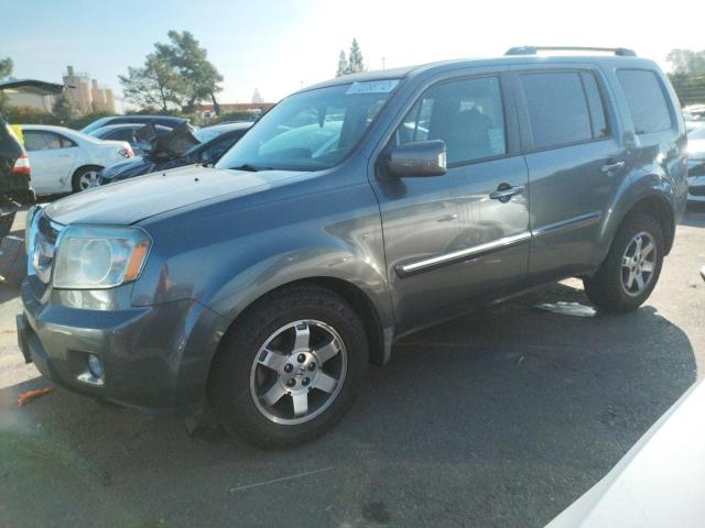HONDA PILOT TOUR 2010 with VIN 5FNYF4H89AB027896 - Photo from auction
