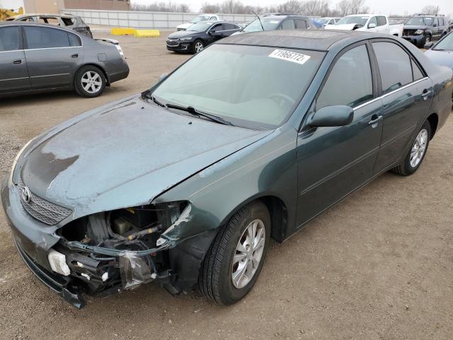 TOYOTA CAMRY LE 2004 with VIN 4T1BF32K64U072001 - Photo from auction
