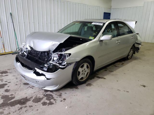 TOYOTA CAMRY LE 2002 with VIN 4T1BF32KX2U516400 - Photo from auction