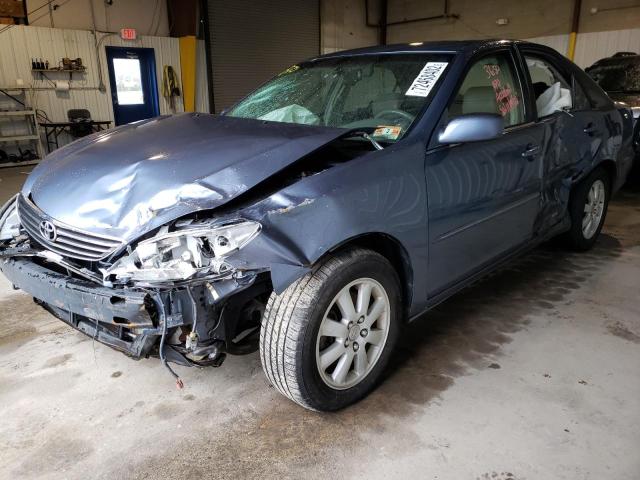 TOYOTA CAMRY LE 2003 with VIN 4T1BF30K03U560474 - Photo from auction