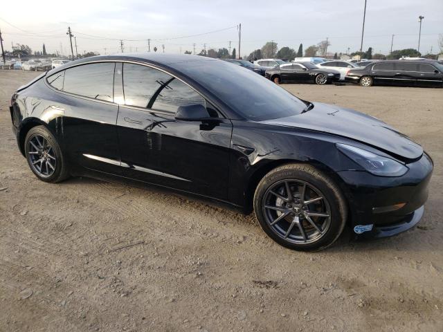 Photo 4 from auction – 2022 TESLA MODEL 3 with VIN 5YJ3E1EB9NF130821
