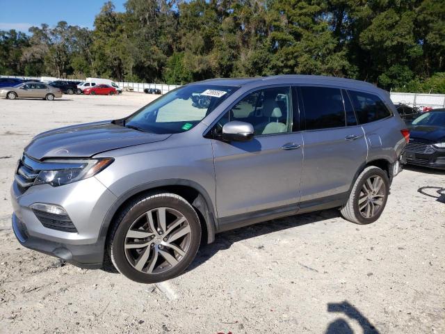 HONDA PILOT ELIT 2016 with VIN 5FNYF6H02GB092961 - Photo from auction