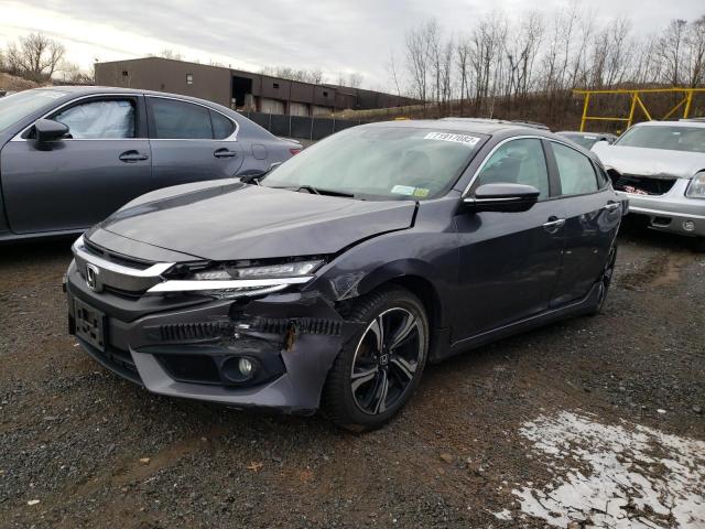 HONDA CIVIC TOUR 2016 with VIN 2HGFC1F96GH641870 - Photo from auction