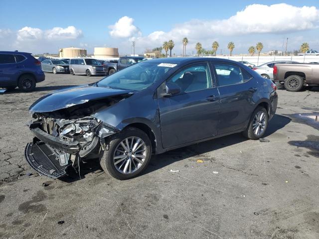 TOYOTA COROLLA L 2014 with VIN 5YFBURHE5EP165847 - Photo from auction
