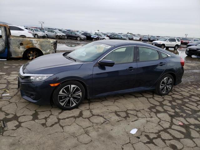 HONDA CIVIC EX 2018 with VIN JHMFC1F32JX040919 - Photo from auction