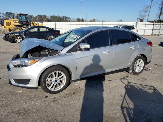 FORD FOCUS SE 2017 with VIN 1FADP3F2XHL282560 - Photo from auction