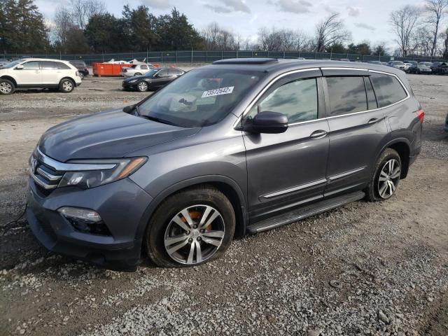 HONDA PILOT EXL 2016 with VIN 5FNYF5H5XGB014367 - Photo from auction