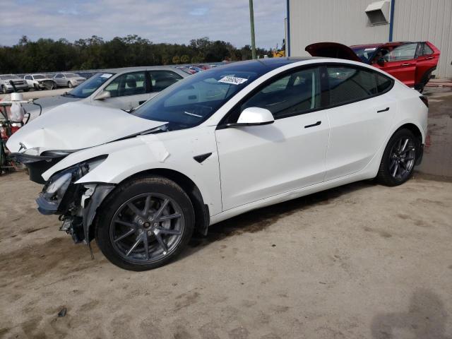 TESLA MODEL 3 2022 with VIN 5YJ3E1EB1NF104584 - Photo from auction
