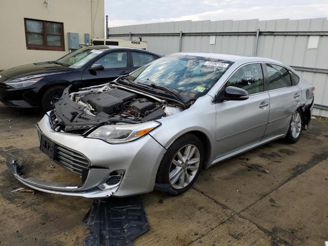 TOYOTA AVALON 2014 with VIN 4T1BK1EB4EU106594 - Photo from auction